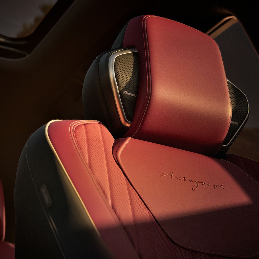 Individual front-row headrest speakers